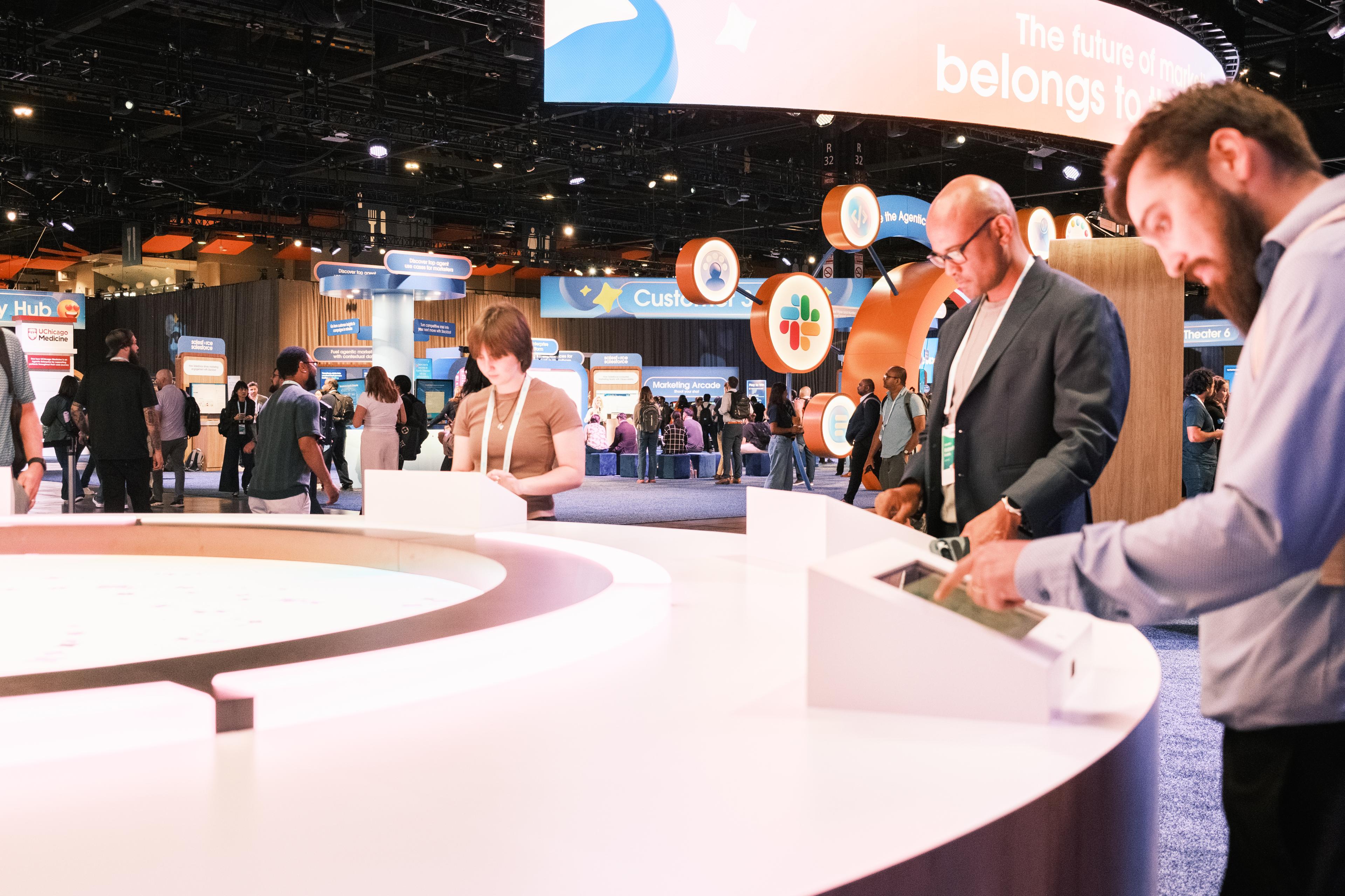 Busy trade show convention floor with professional attendees at interactive booths